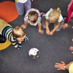 children on floor playing a game