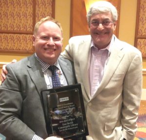 Rob Lesher (left) accepting award for east Berlin Community Library